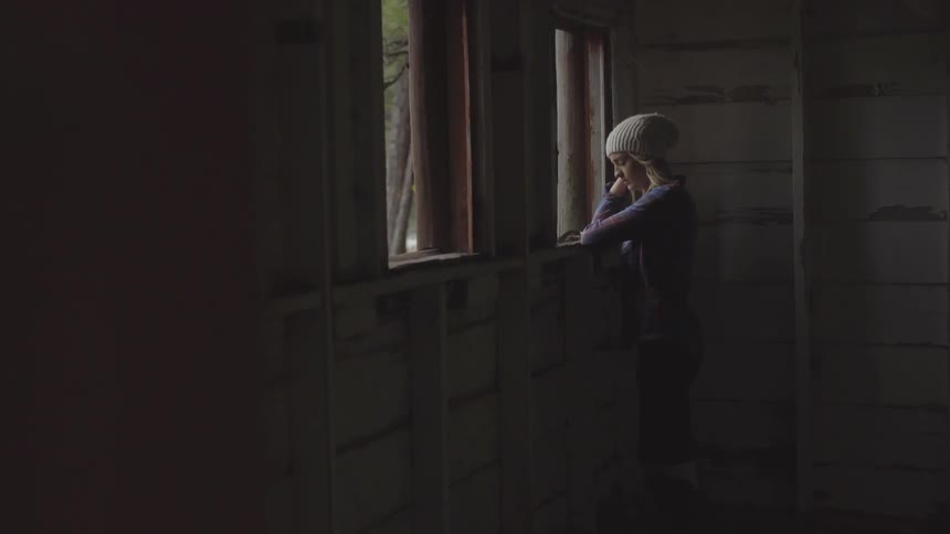 A woman looking out a window
