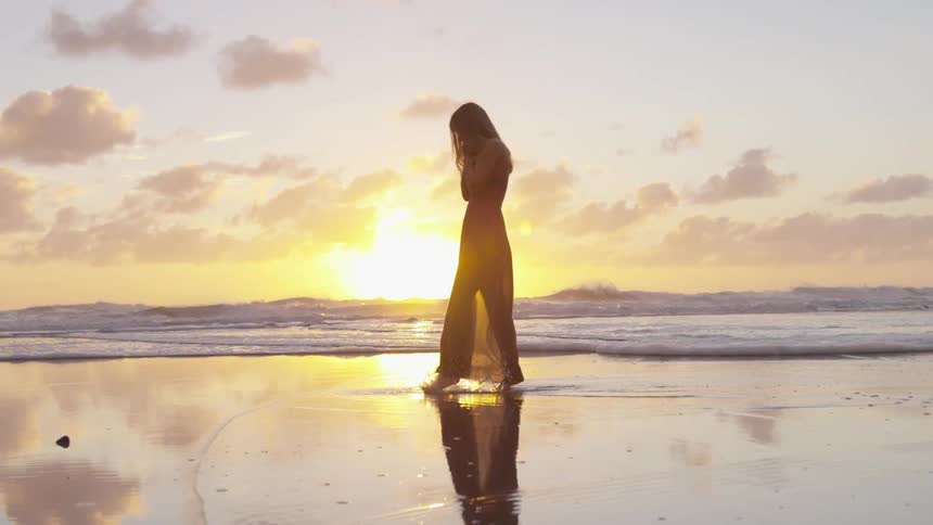 Girl walking along a beach