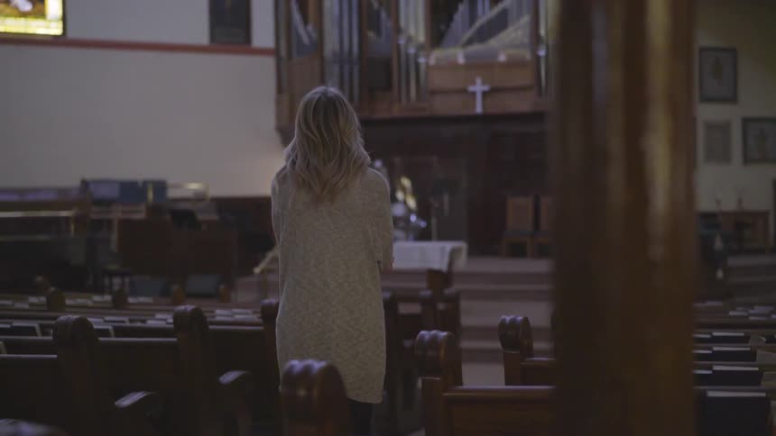 A woman standing in a church