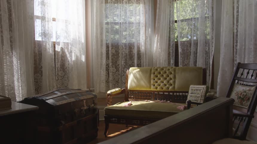 Sun rays through the window of the house with chest and chair