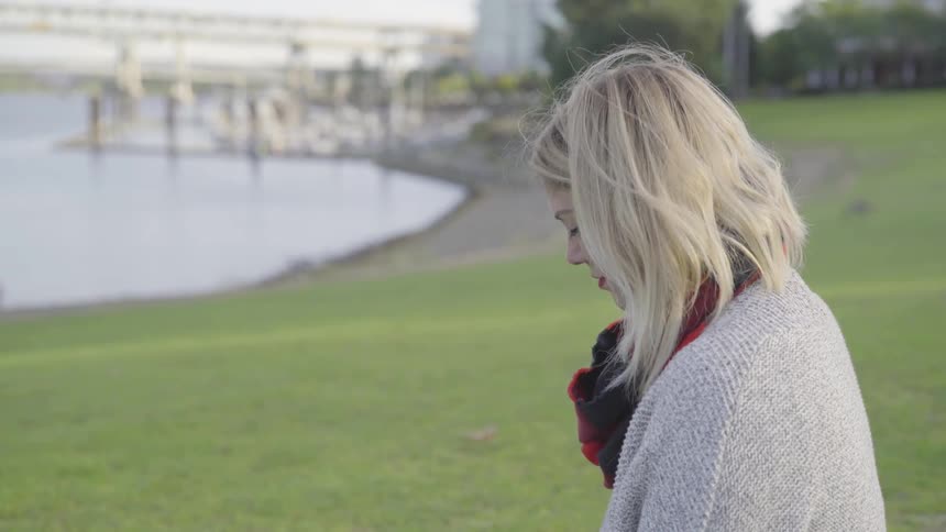 Girl looking over a river