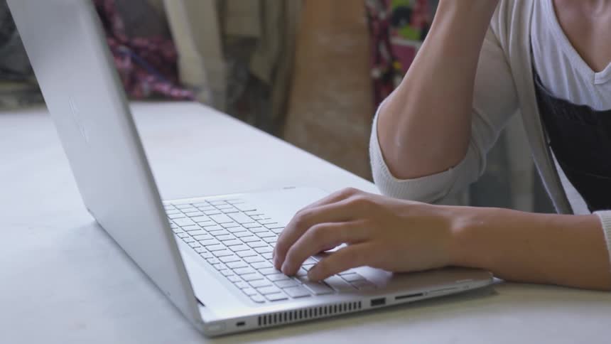 Female typing on a computer
