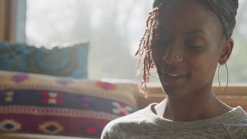 A woman smiling at something off screen