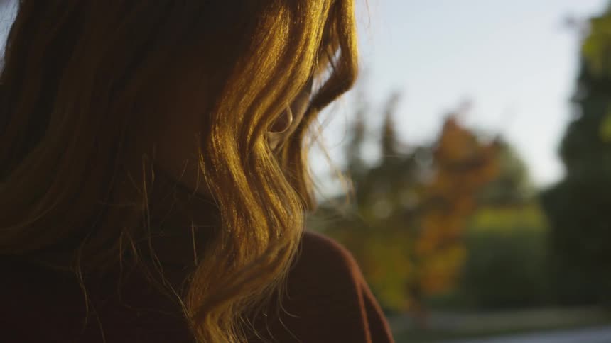 A woman standing outdoors during the day