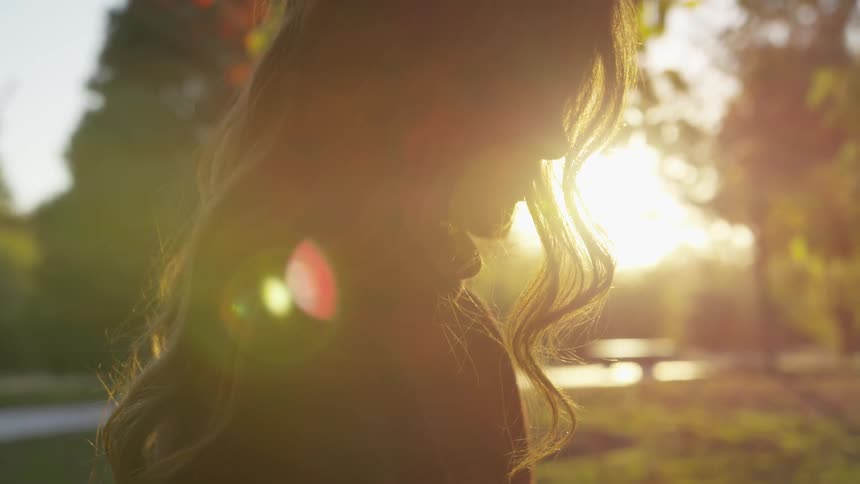 Girl standing in the sunlight