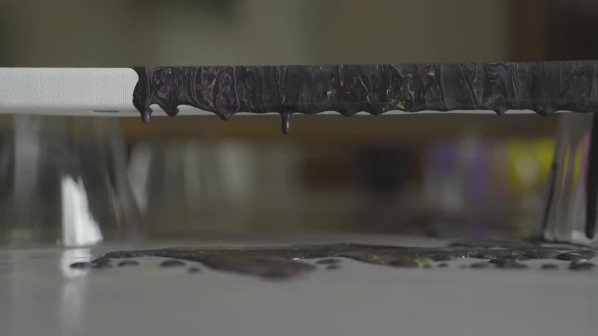 Paint is dripping from an aluminum paint tray