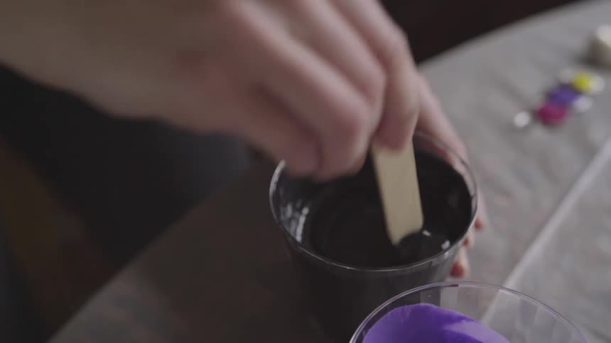 Person mixing paint