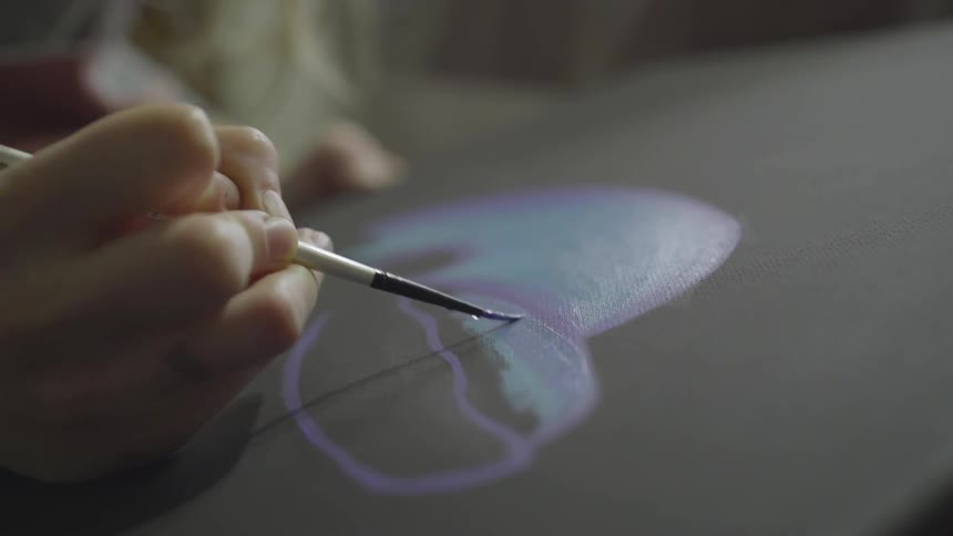 A person painting a heart