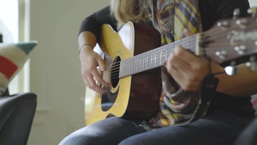 Girl playing guitar