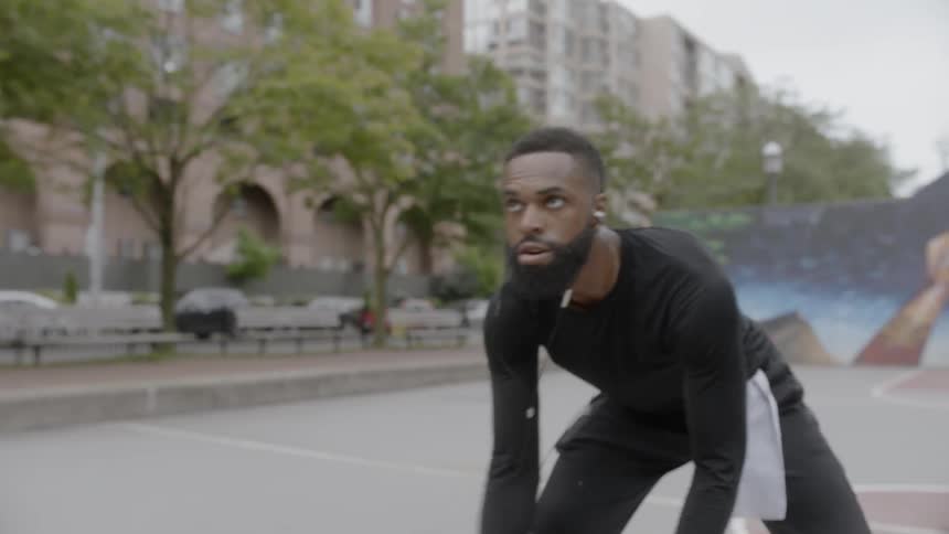 Black man playing basketball