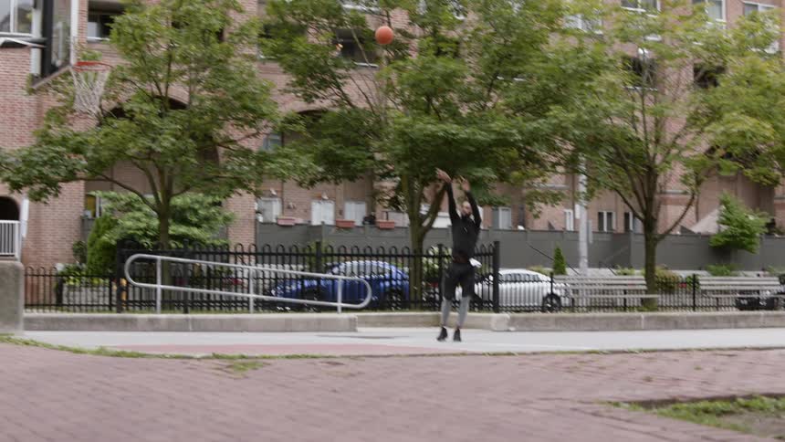 A man shoots a basketball