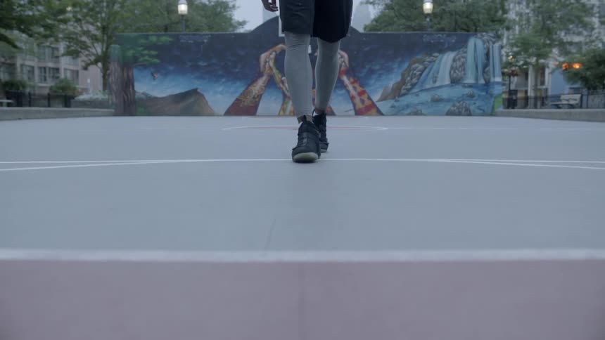 Black man walking on the court