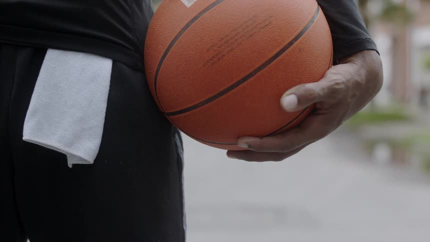 A man holding a basketball