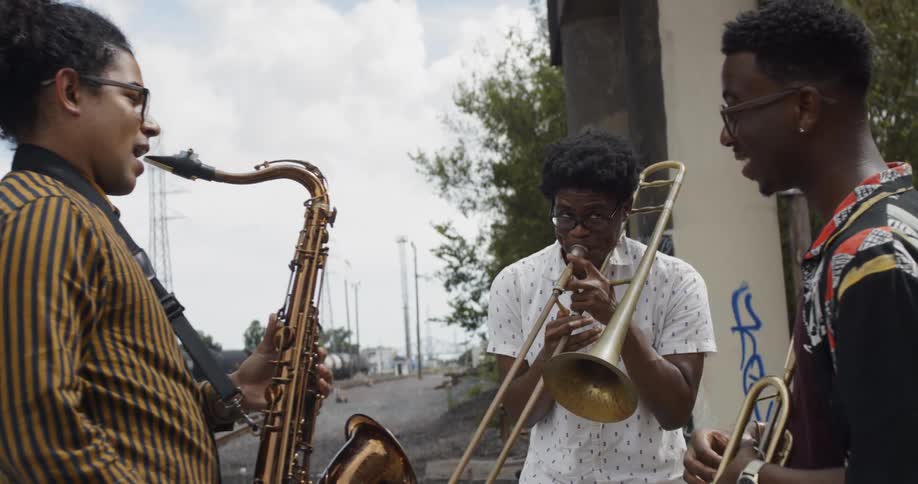 Friends playing brass instruments