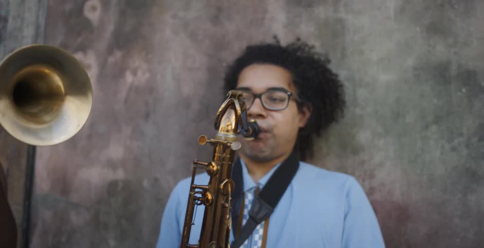 A guy playing a saxophone