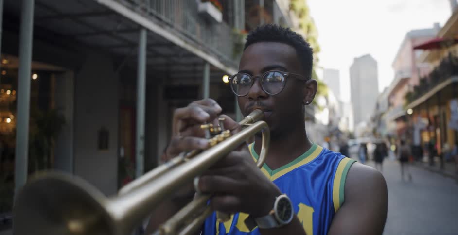 A man plays trumpet on the street