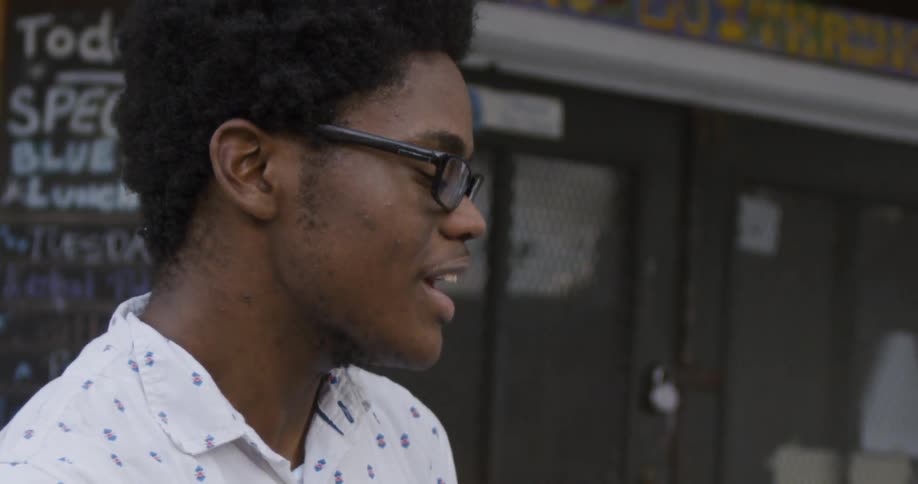 Young man nods and smiles