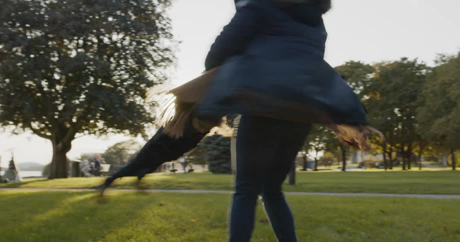 Mom spinning around a child