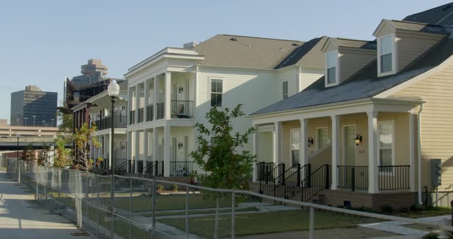 Stately old homes sit in a row off the street