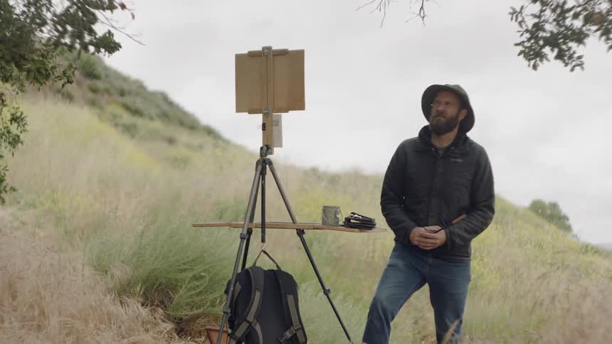 Man painting on a canvas