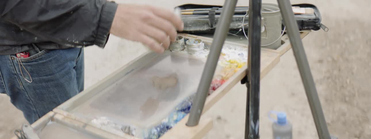 Man painting on a canvas