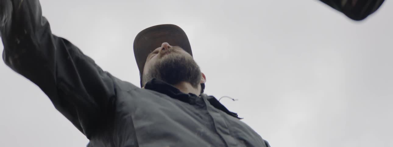 A man is drawing something off screen