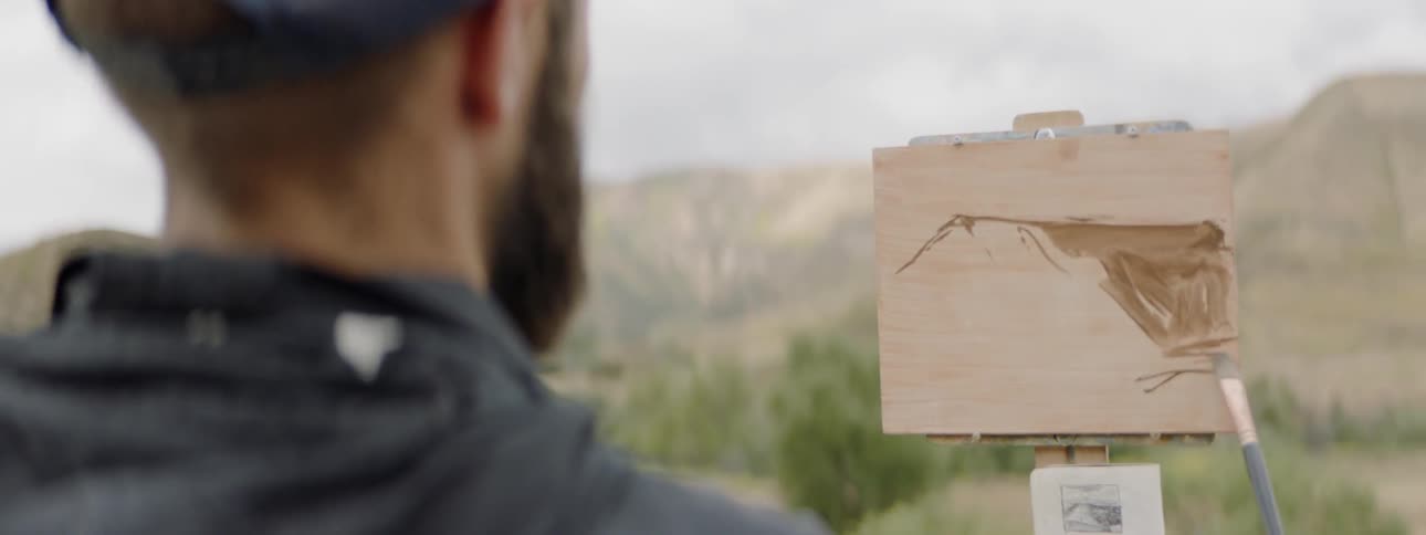 Man painting on a canvas