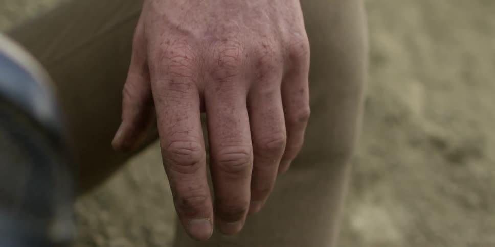 A man's work roughened hand