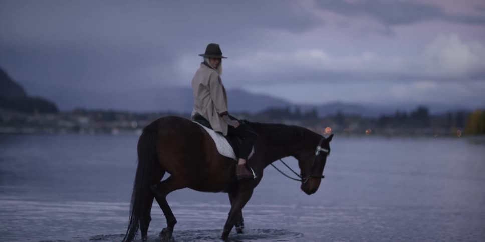 Woman Riding Horse In Lake