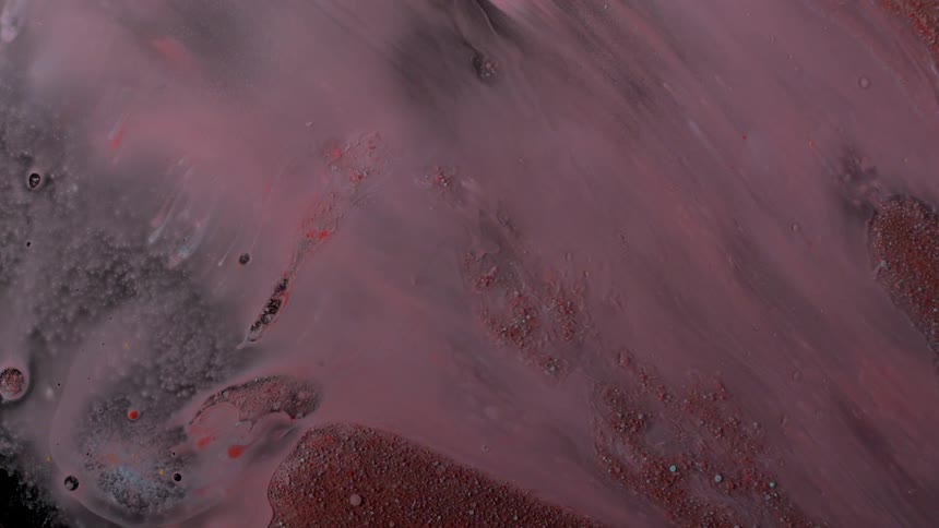 Red and white debris in a black area