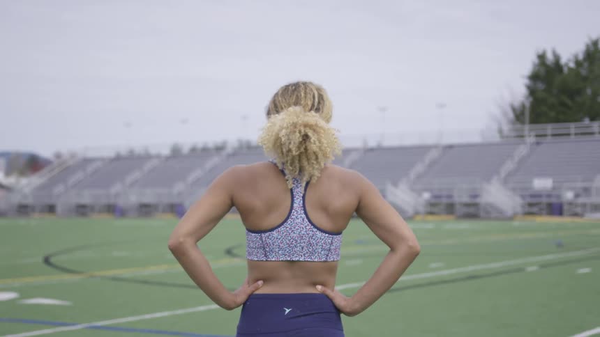 An athlete walking across a field