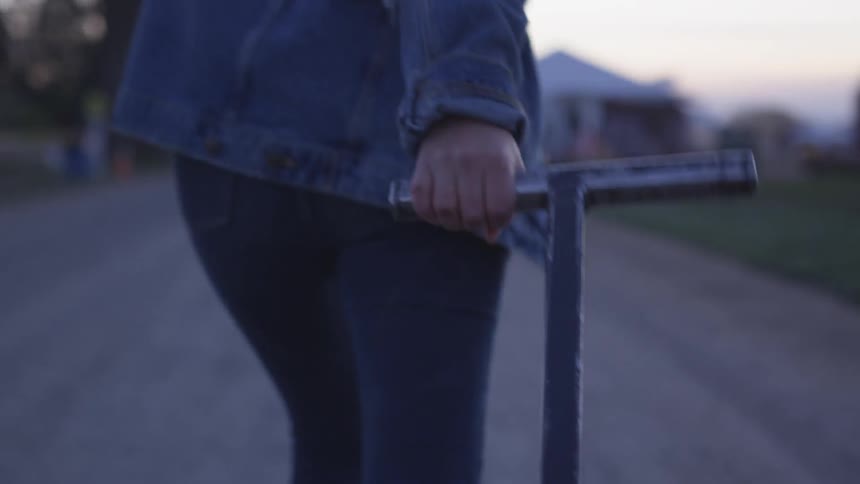A person pulls a wagon down a road