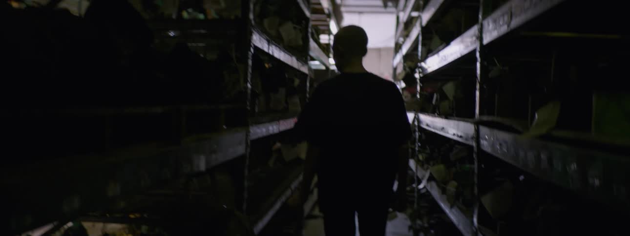 Man walking down an isle