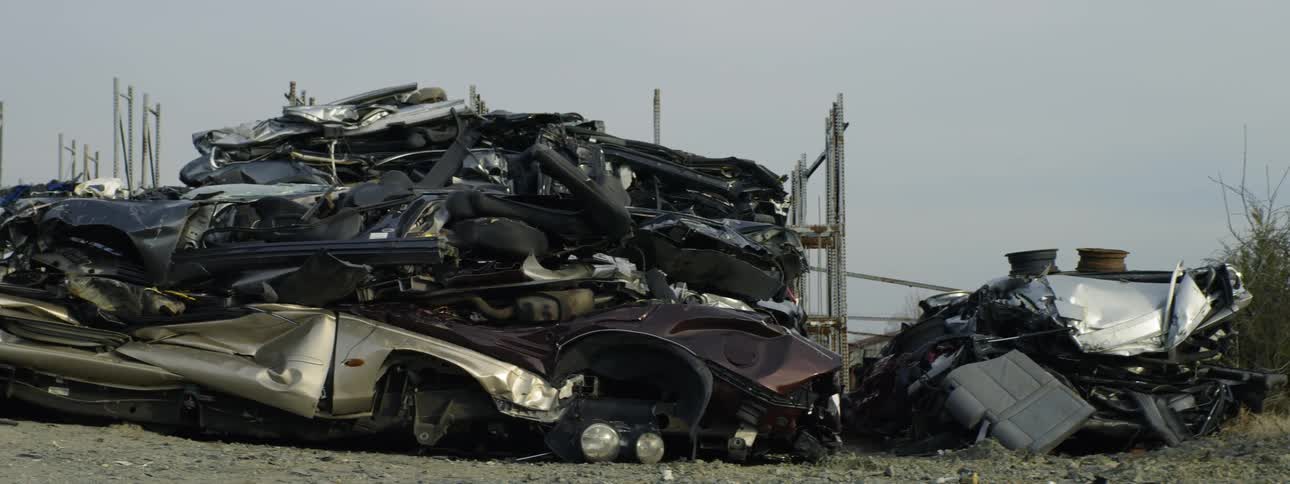 The vehicles are crushed in the lot
