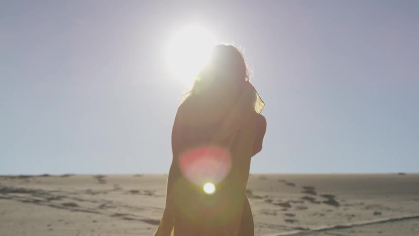 Girl walking on the beach