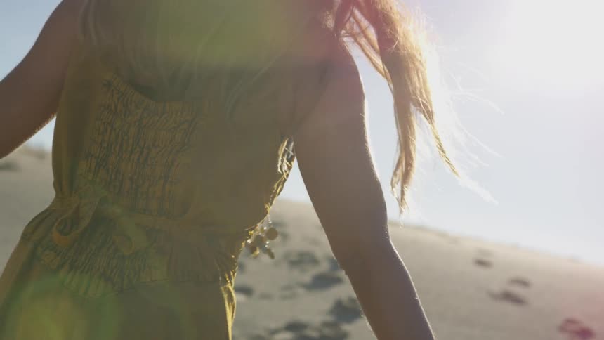 A woman walking with a blanket