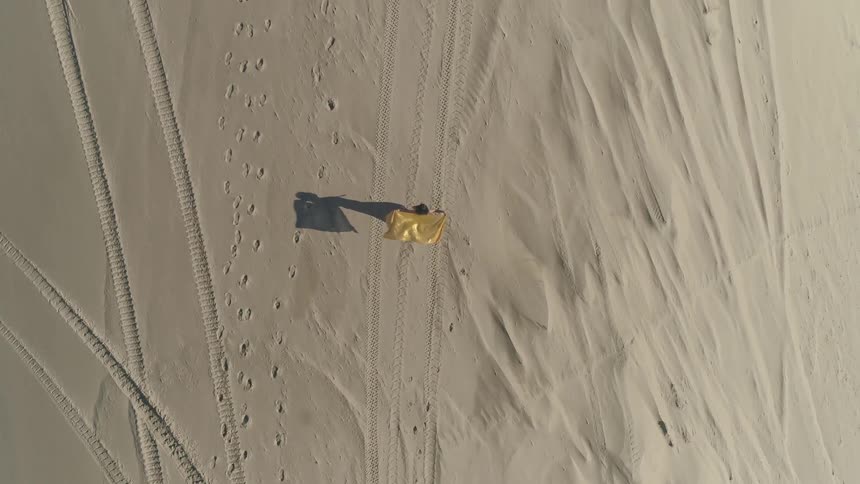Person walking along the beach
