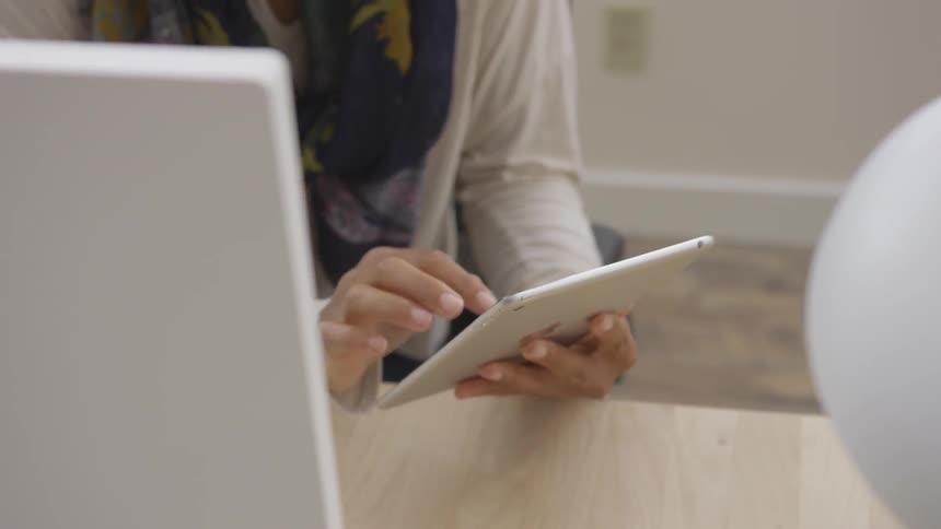 A person using a tablet in an office
