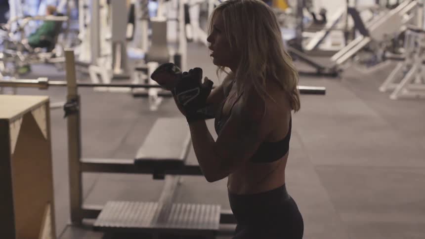 Woman practicing boxing on a gym