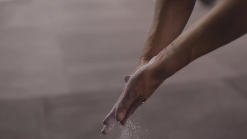 A person takes their hands out of a bucket of water