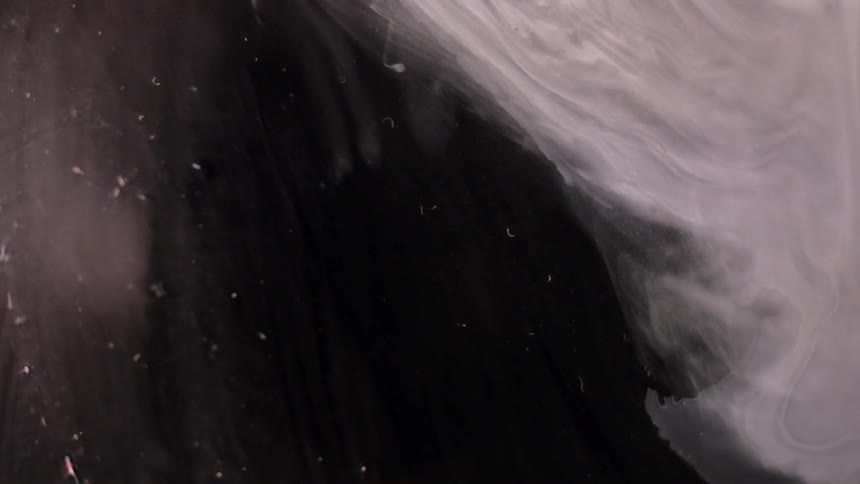 Haze flows against a black backdrop