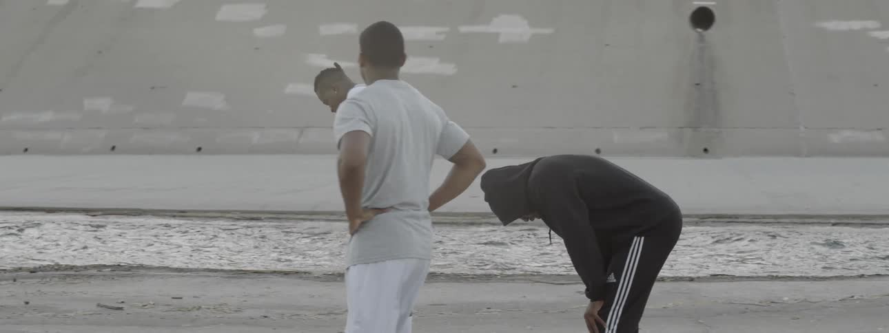 Three men catch their breath