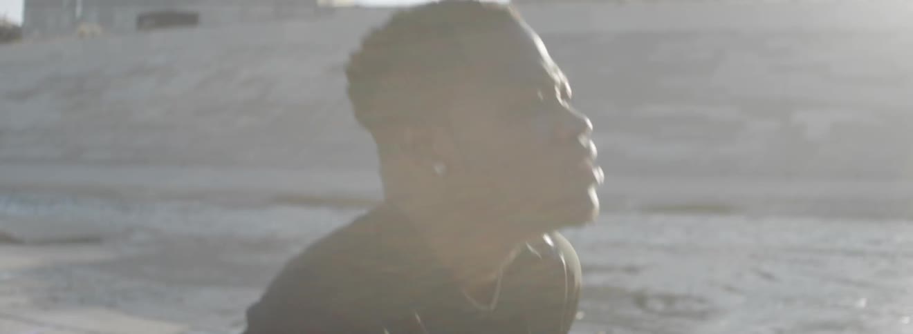 A man outside breathing heavy