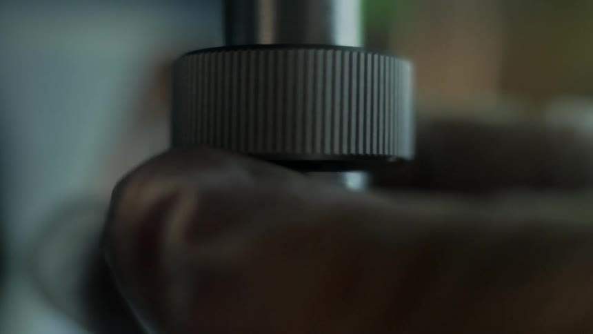 A gear is shown being measured