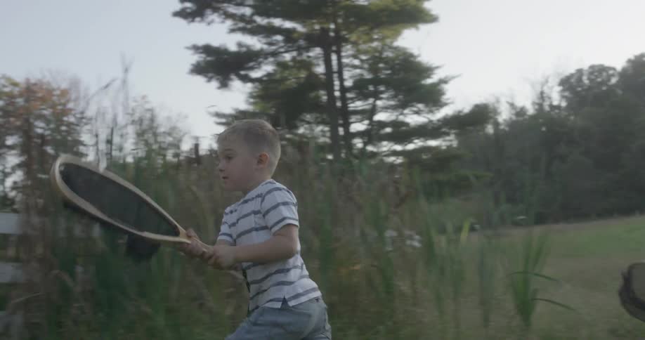 A boy running with a net