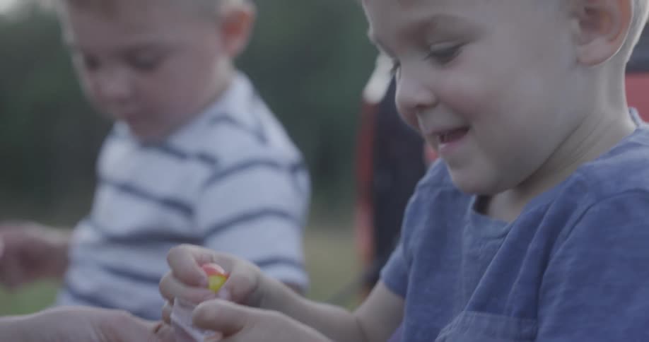 Child gets ball from bag