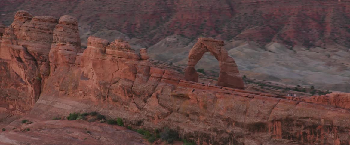 Large boulders and a wide canyon with vegetation