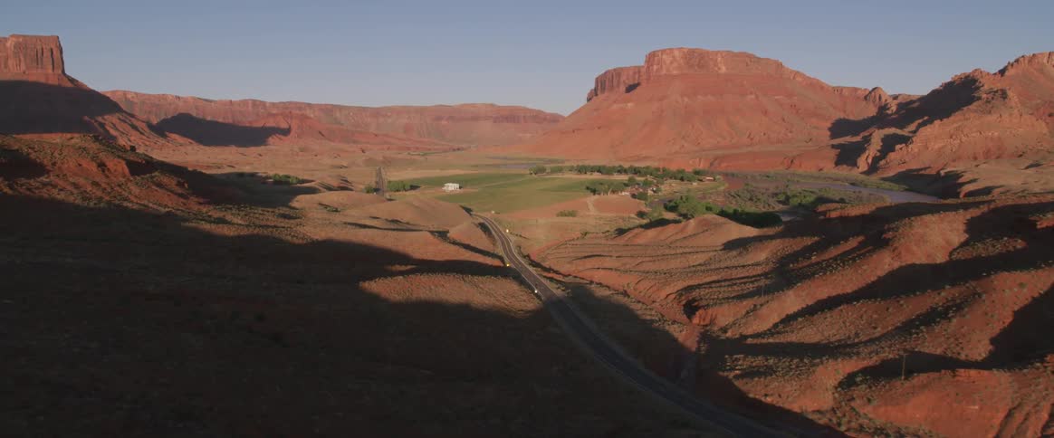 Rock formations flow around a road