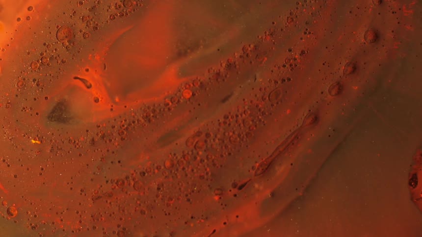 Water bubbles pop in a sample of moisture