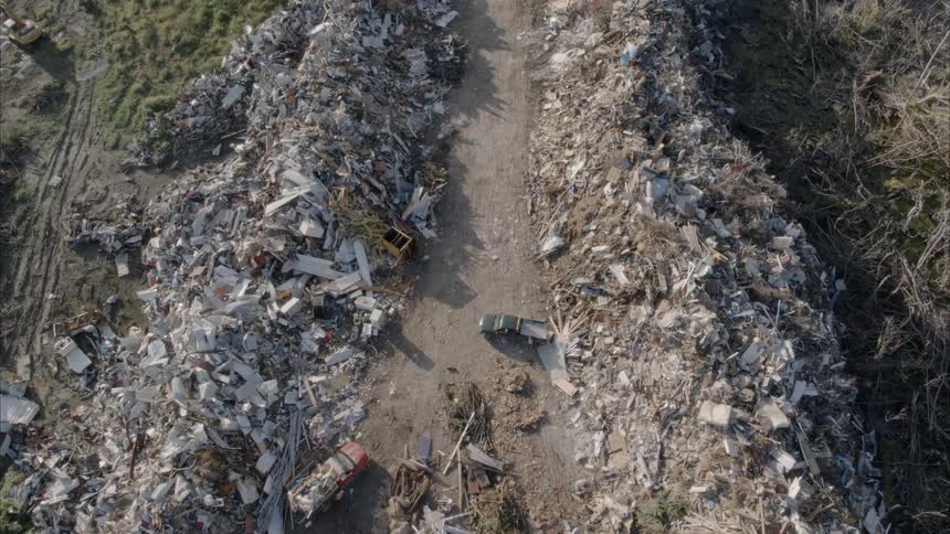 Junk piled up on sides of road